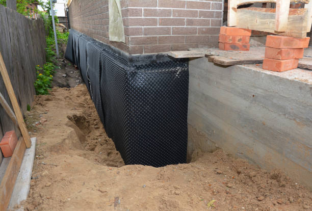 SJ Waterproofing Pros technician performing targeted Foundation Crack Repair assessment in East Liberty, OH